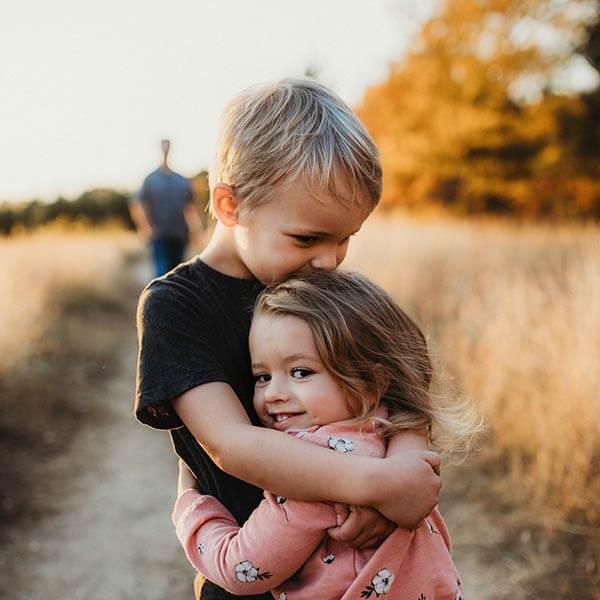 loving siblings hugging each other